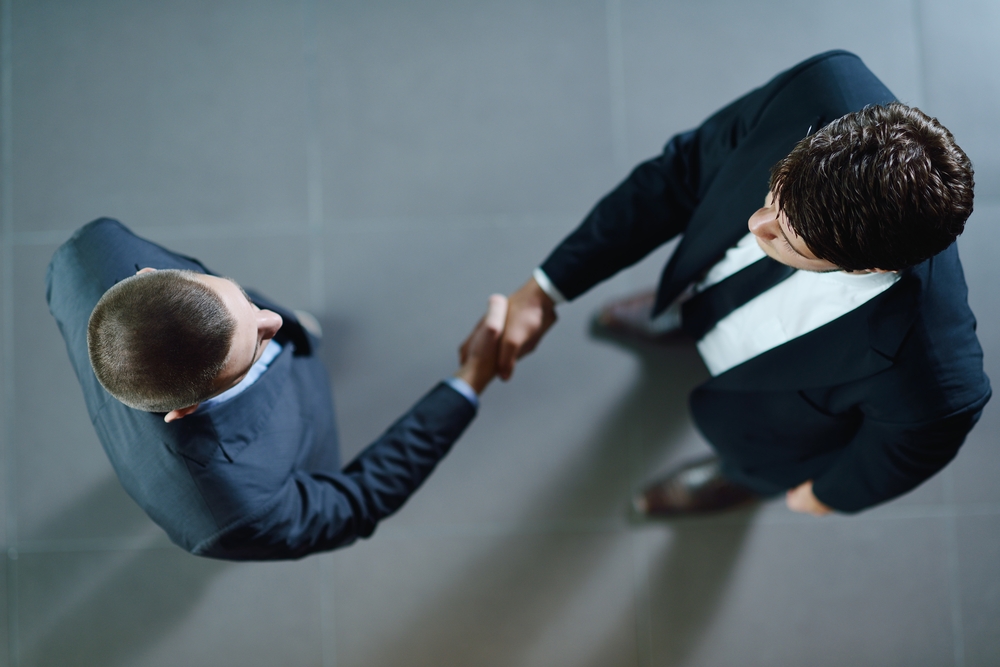 business people shaking hands make deal and sign contract